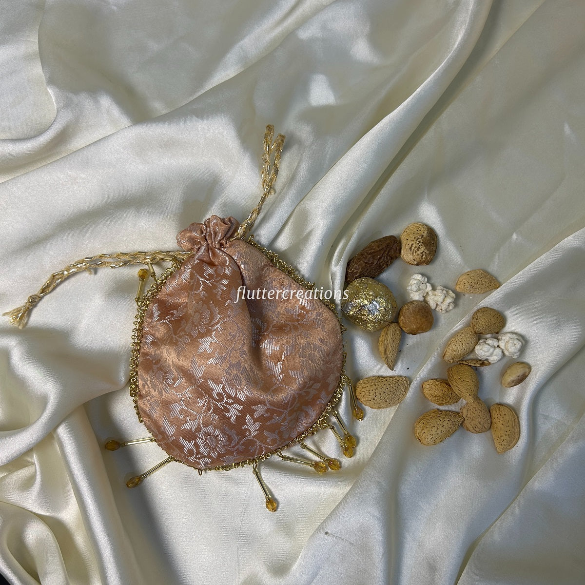 Peach Jamawar Pouches with Jhalar Lace