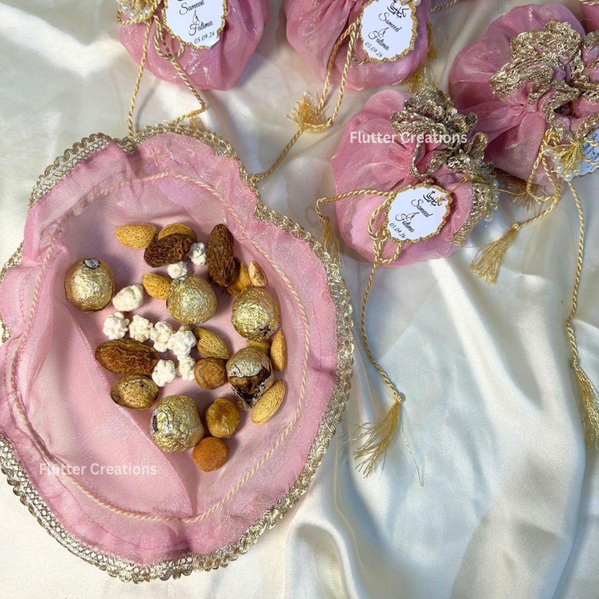 Blush Pink Double Organza Potlis with single pearl tassel and name tag