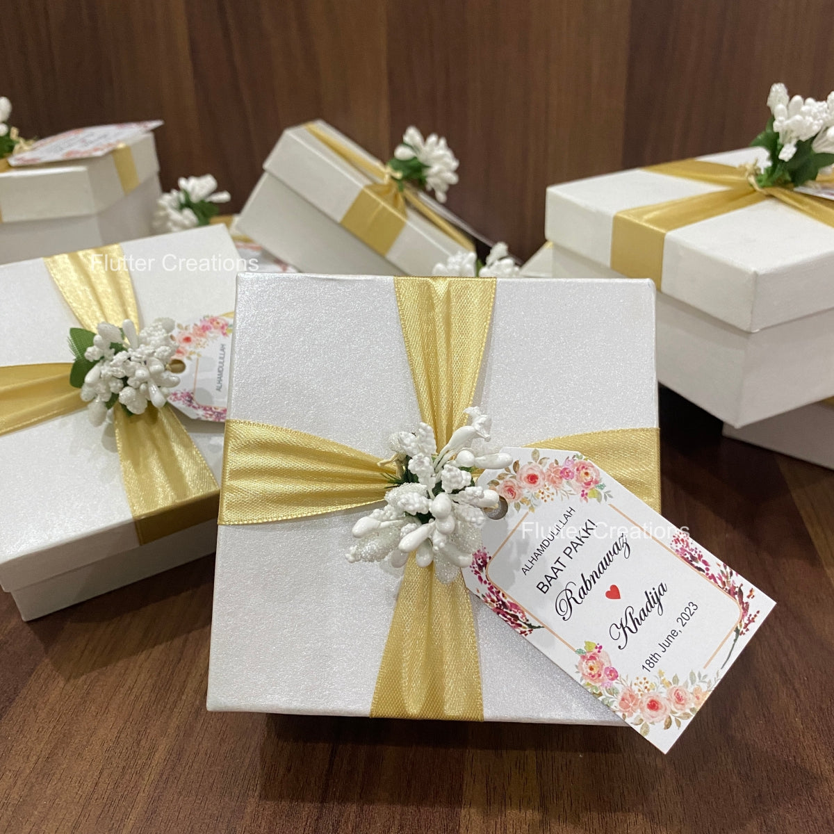 White Box with Golden Ribbon