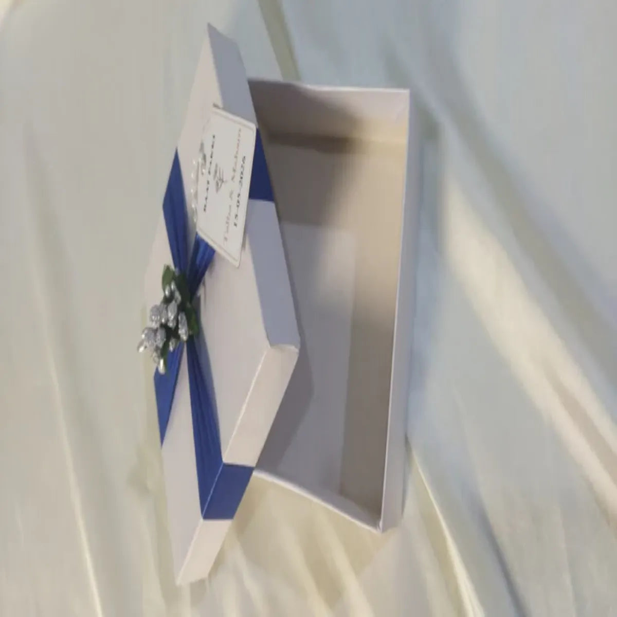 White Box with Blue ribbon and Silver Stamen flowers
