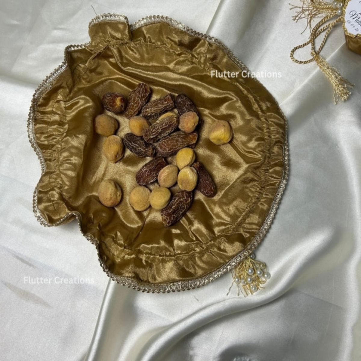 Brown Organza potlis with Silk Lining,pearl tassel and tag