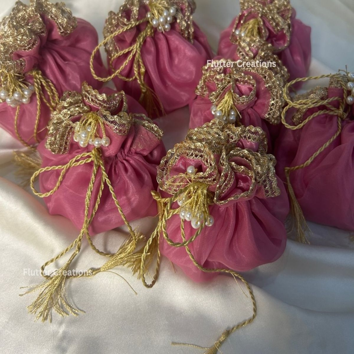 Tea Pink Organza potlis with Pearl tassel and name tag