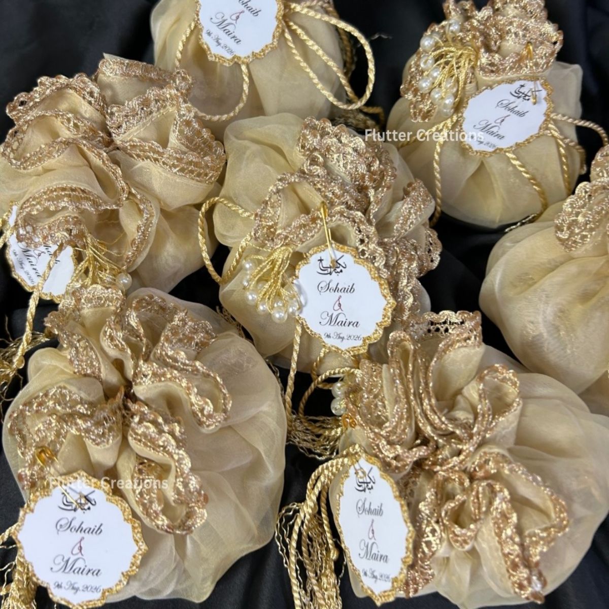 Beige Organza Potlis with single pearl tassel and name tag
