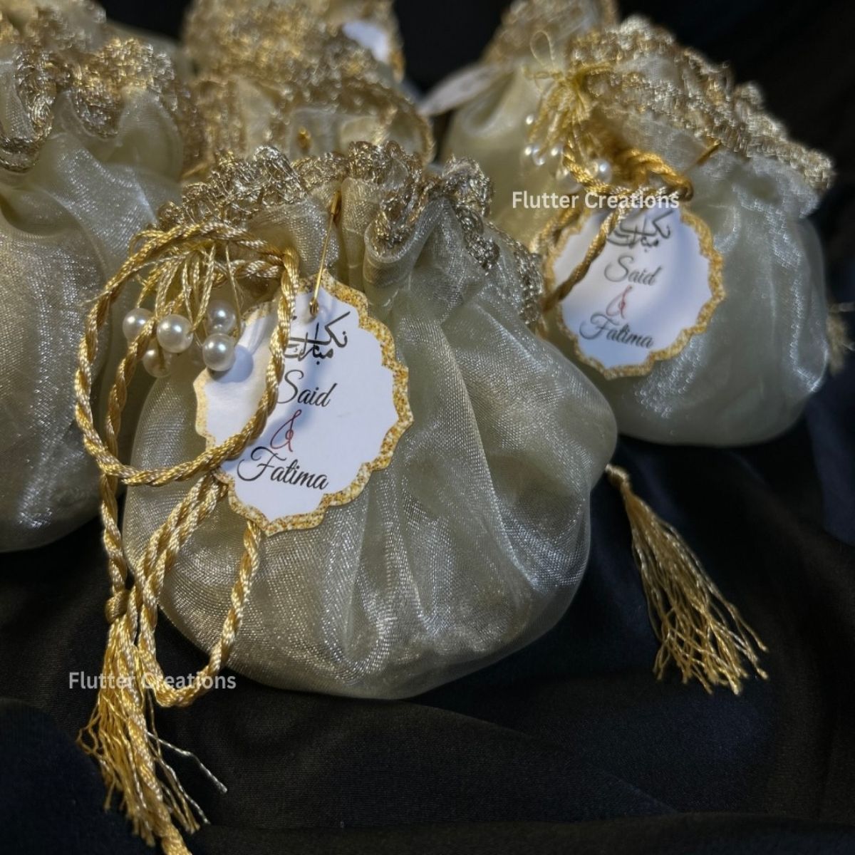 Ivory/Off White Organza potlis with pearl lace and tassel