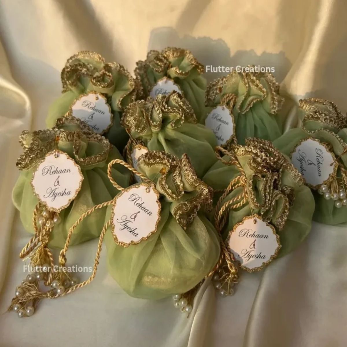 Light green Organza Potlis with double pearl tassel and name tag