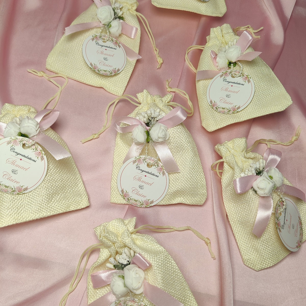 Premium White Pouches/potlis with Ribbon,flower and name tag