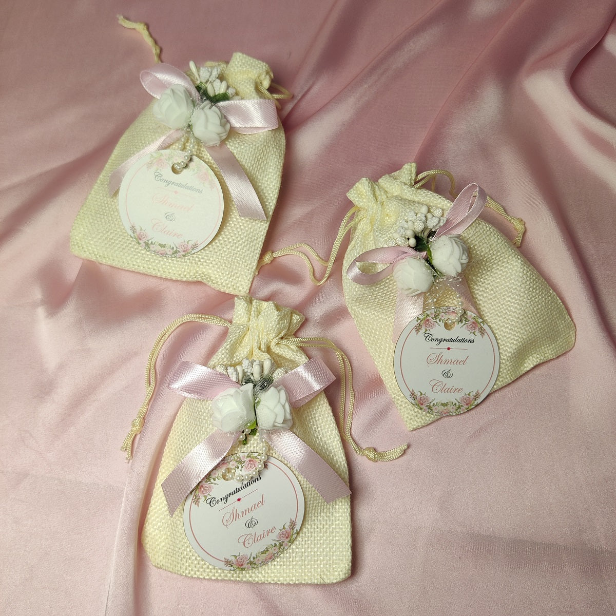 Premium White Pouches/potlis with Ribbon,flower and name tag
