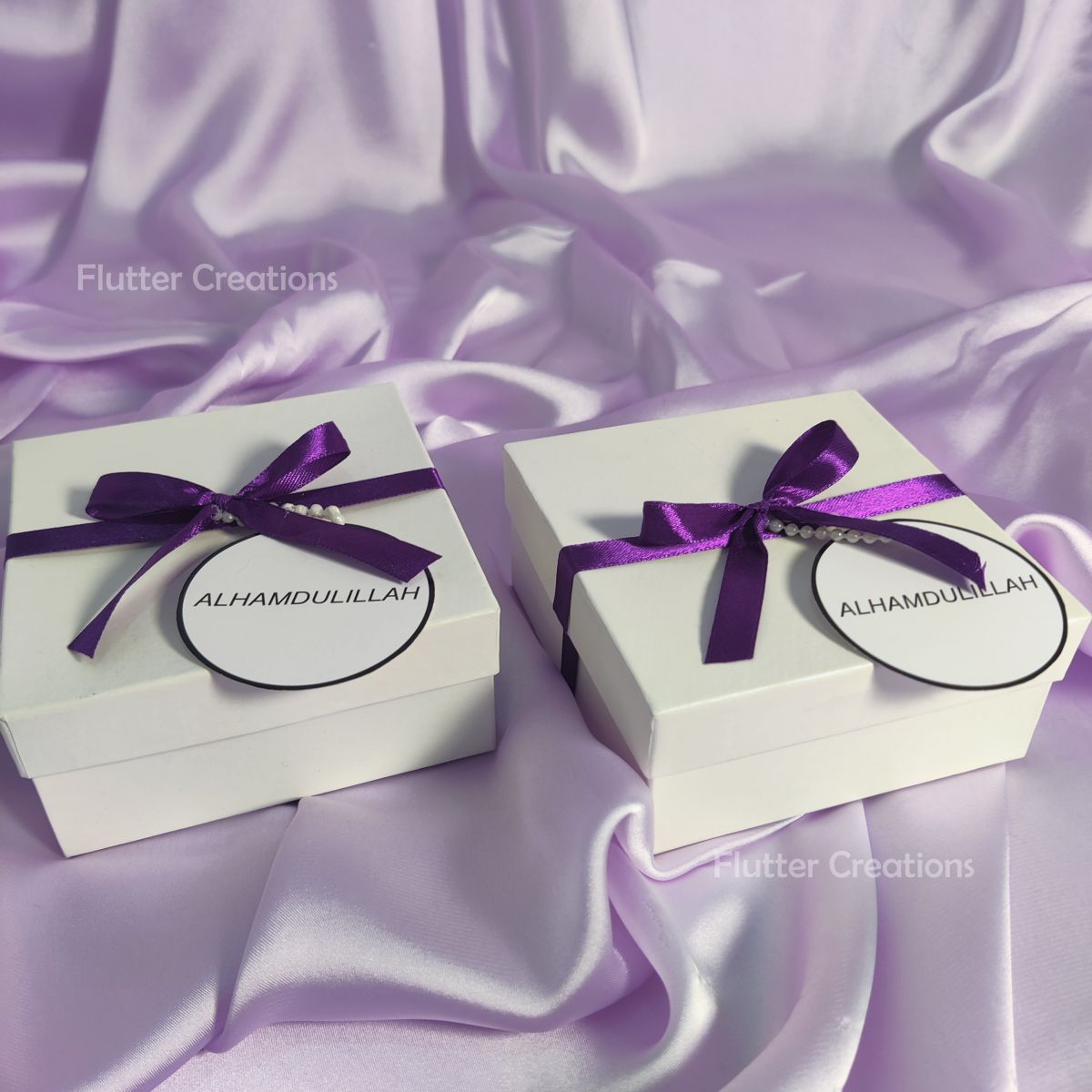 White Box with Blue Ribbon and a Tag