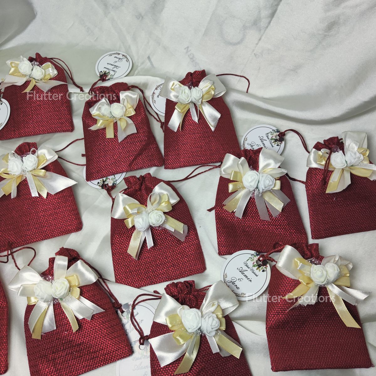 Maroon Jute Pouch with ribbons, flower & a tag
