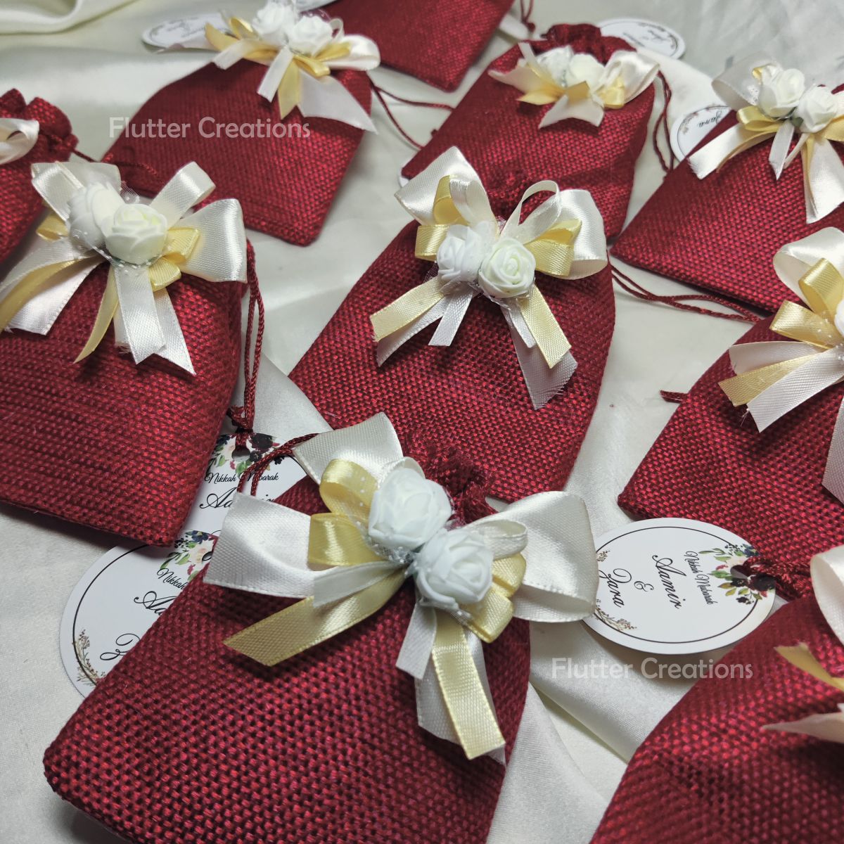 Maroon Jute Pouch with ribbons, flower & a tag