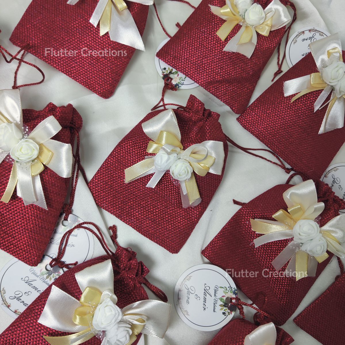 Maroon Jute Pouch with ribbons, flower & a tag