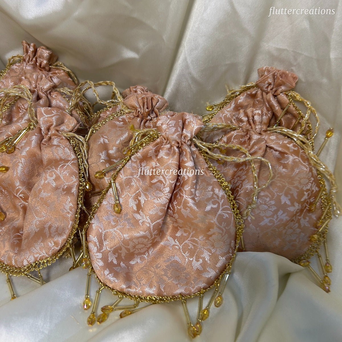 Peach Jamawar Pouches with Jhalar Lace