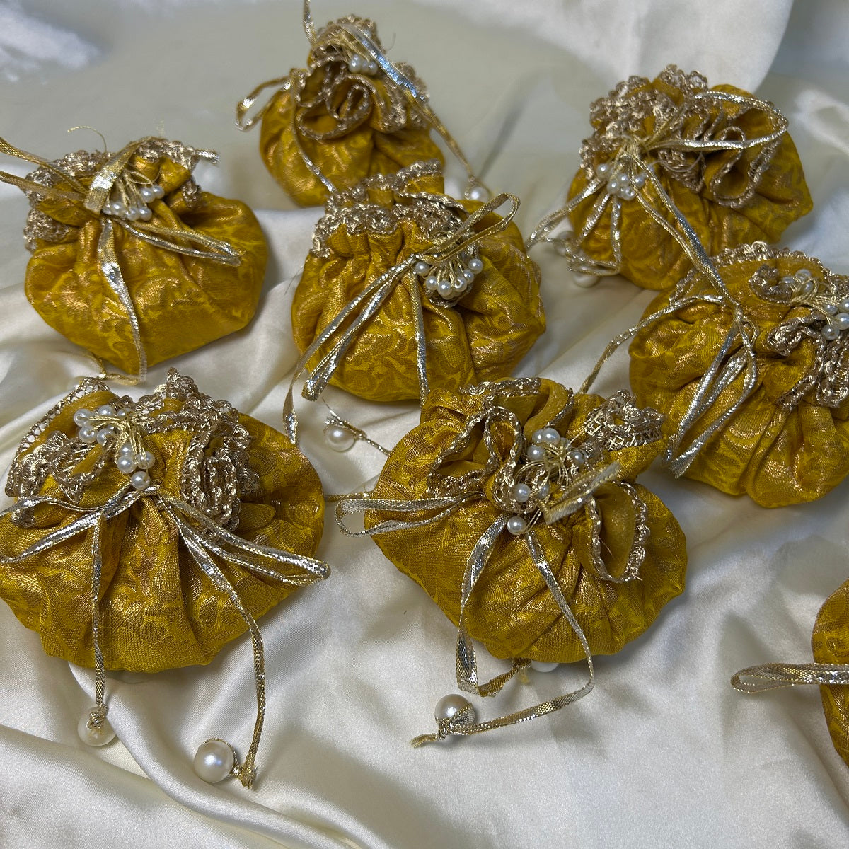 Yellow Jamawar potlis bags with pearl tassel