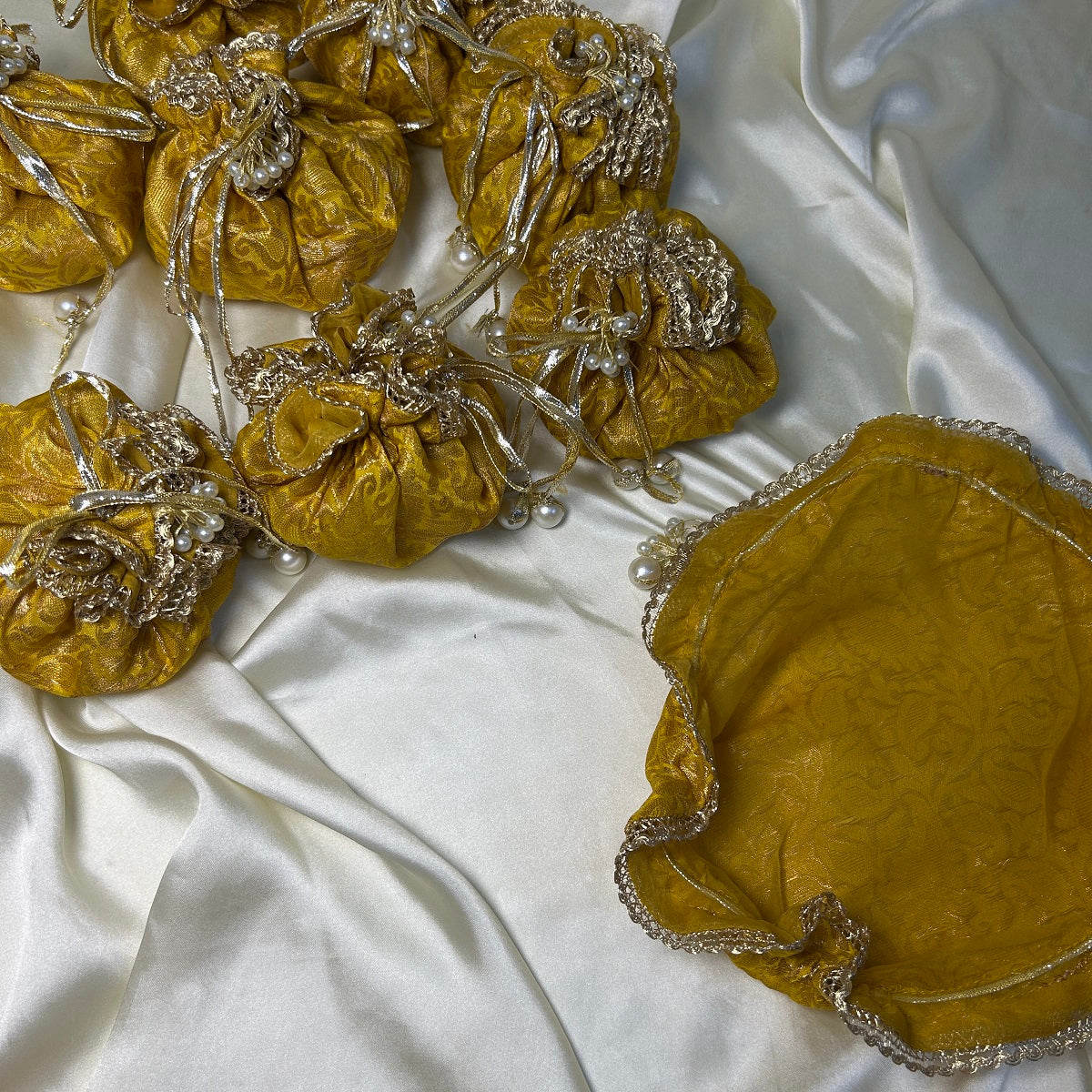Yellow Jamawar potlis bags with pearl tassel