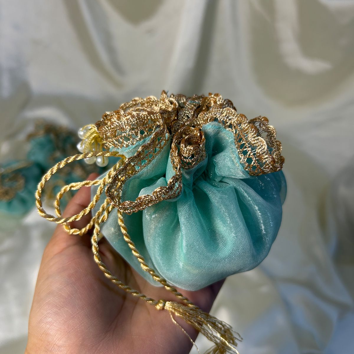 Ice Blue Double Organza potlis with Pearl tassel and name tag
