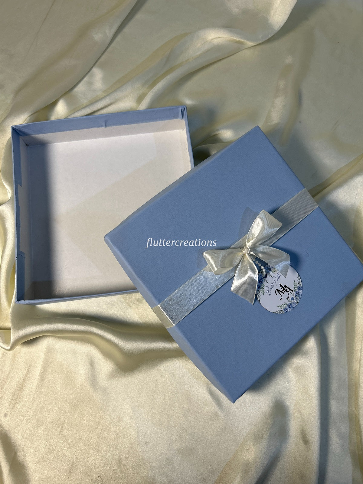 Blue Box with Off white Ribbon and Tag
