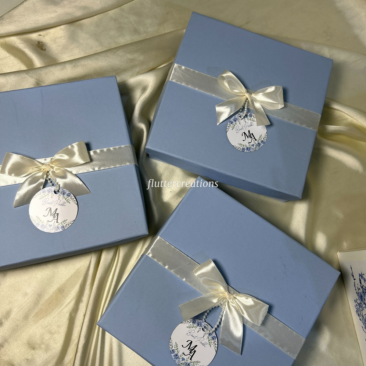 Blue Box with Off white Ribbon and Tag