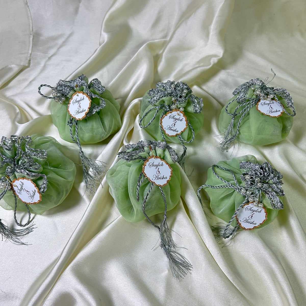 Light green Organza Potlis with Silver String,pearl tassel and name tag