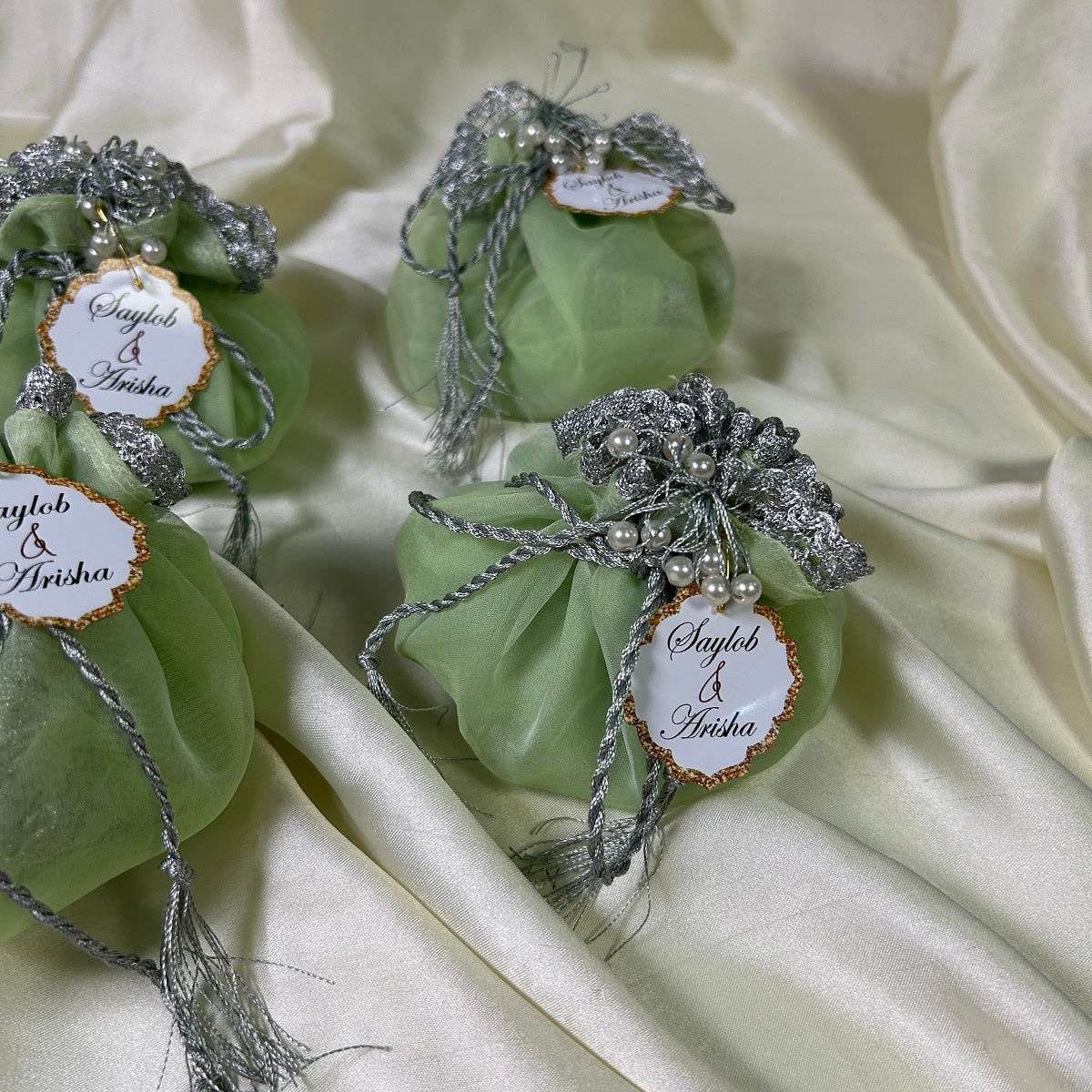 Light green Organza Potlis with Silver String,pearl tassel and name tag