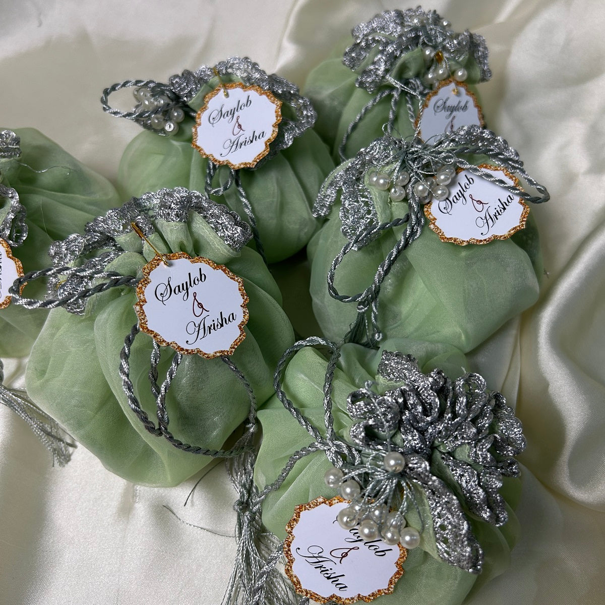 Light green Organza Potlis with Silver String,pearl tassel and name tag