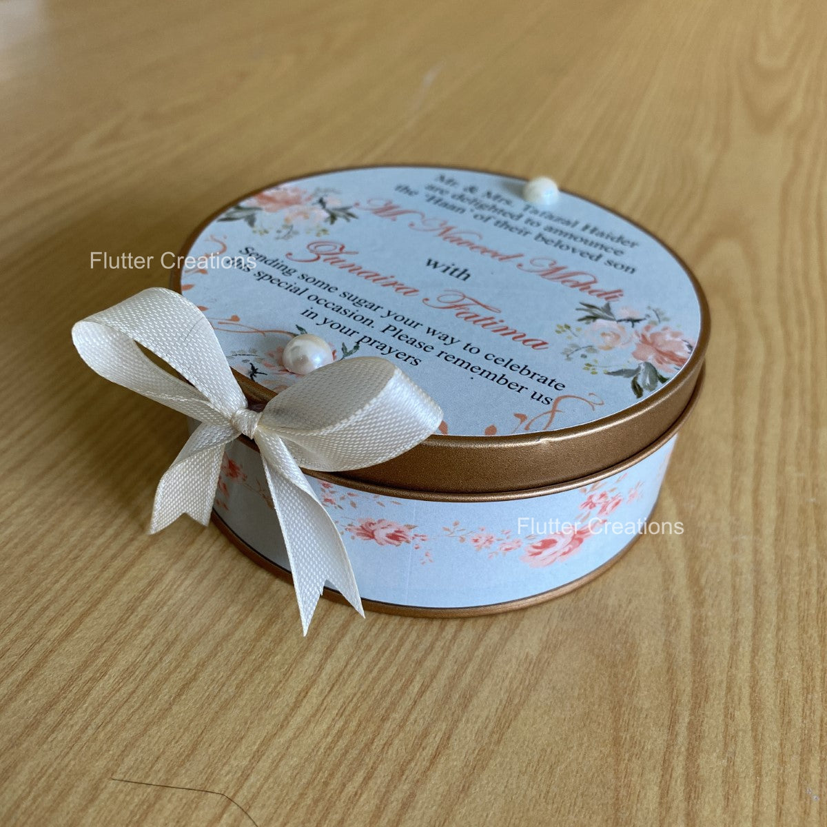 Round Tin Box with customized print, pearl and ribbon