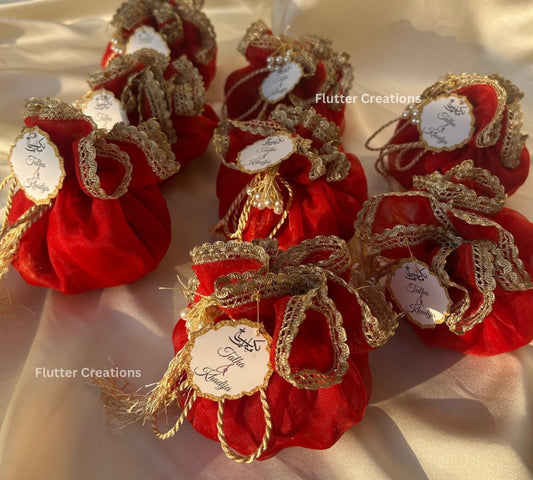 Red Organza potlis with pearl lace and tassel