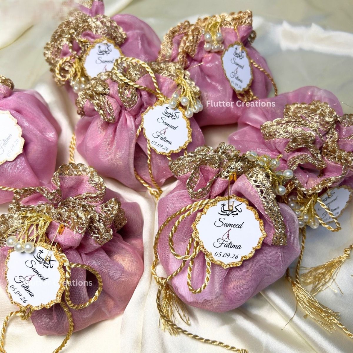 Blush Pink Double Organza Potlis with single pearl tassel and name tag