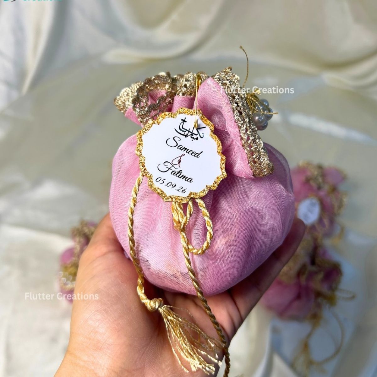 Blush Pink Double Organza Potlis with single pearl tassel and name tag