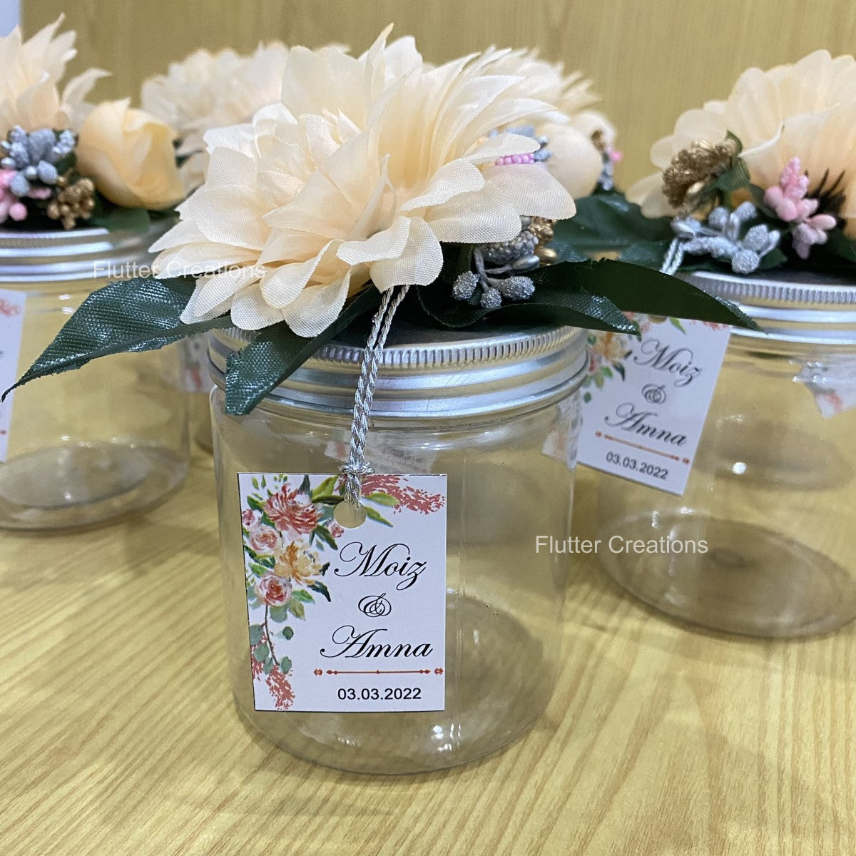 Wedding Jar with floral decor on top	Plastic