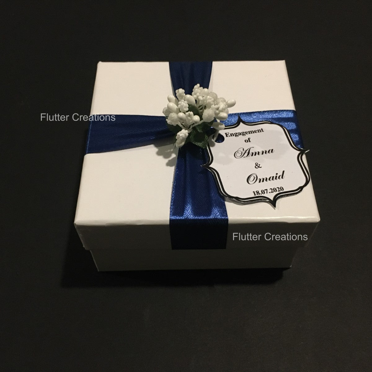 White Box with Blue Ribbon