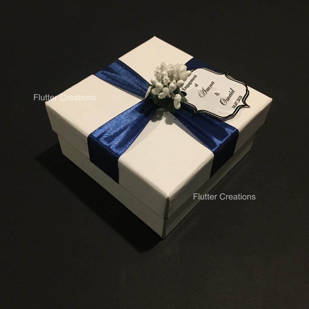 White Box with Blue Ribbon