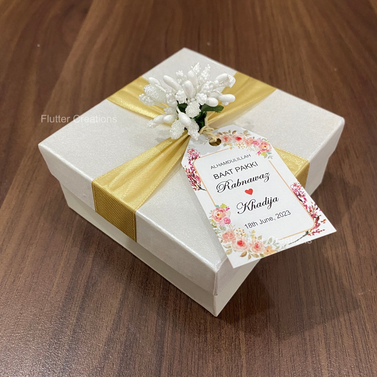 White Box with Golden Ribbon