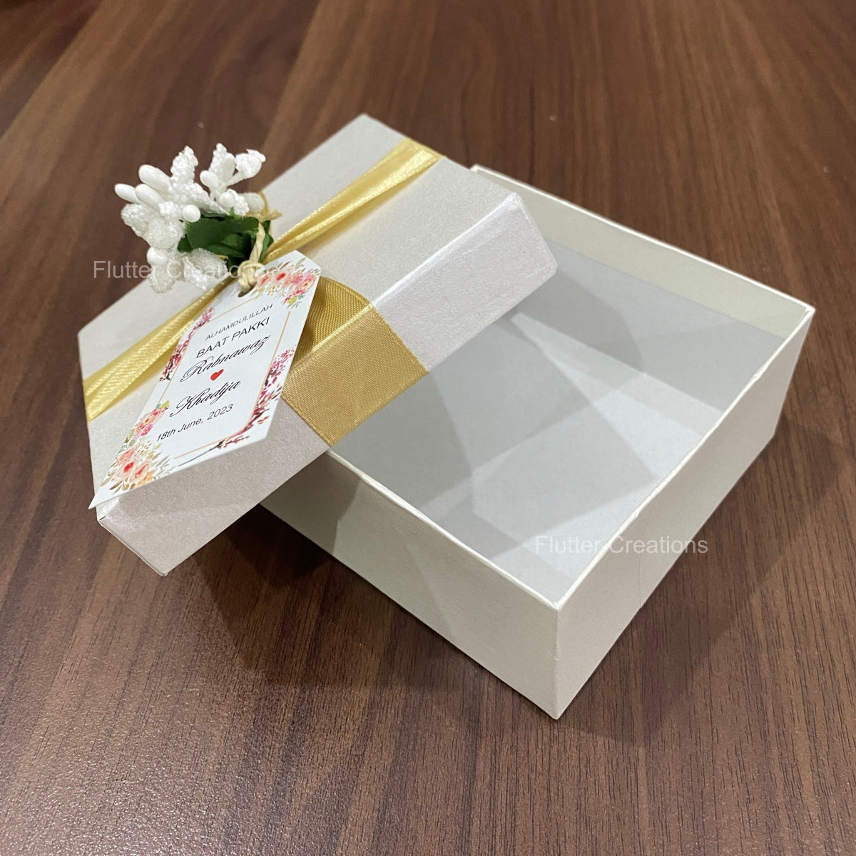 White Box with Golden Ribbon