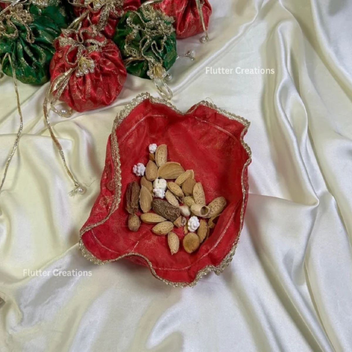 Jamawar potlis bags with pearl tassel