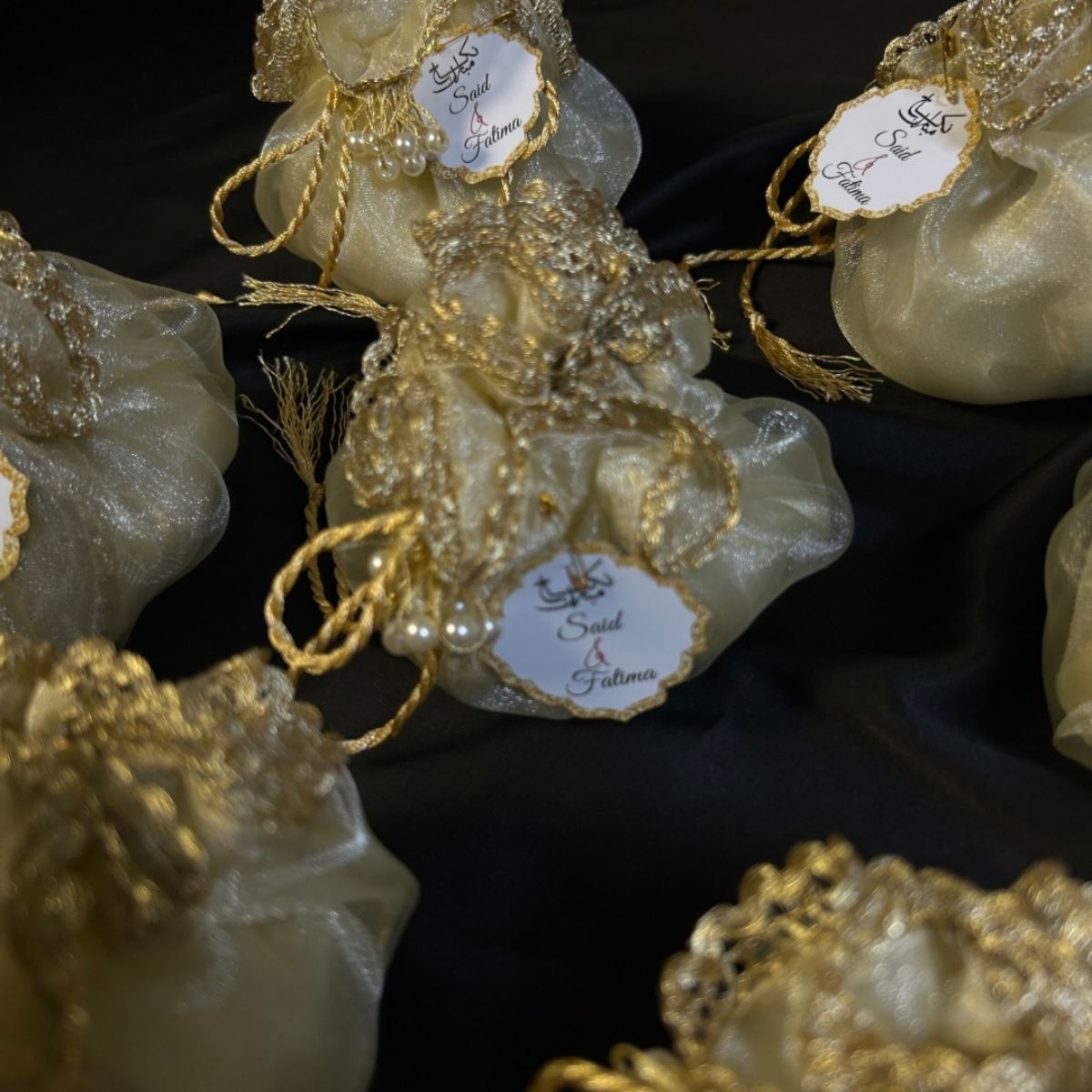 Ivory/Off White Organza potlis with pearl lace and tassel
