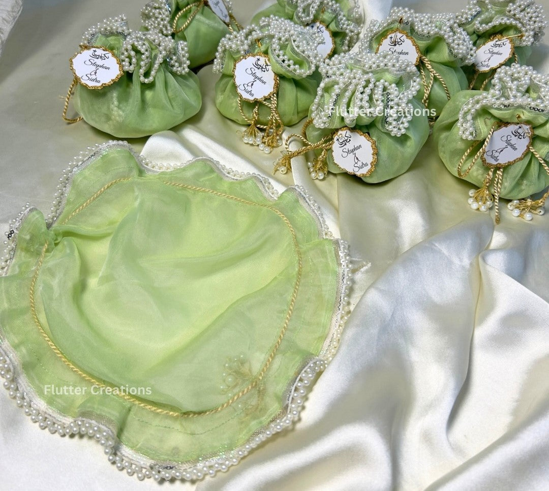 Light Green Organza potlis/pouches with pearl lace and tassel