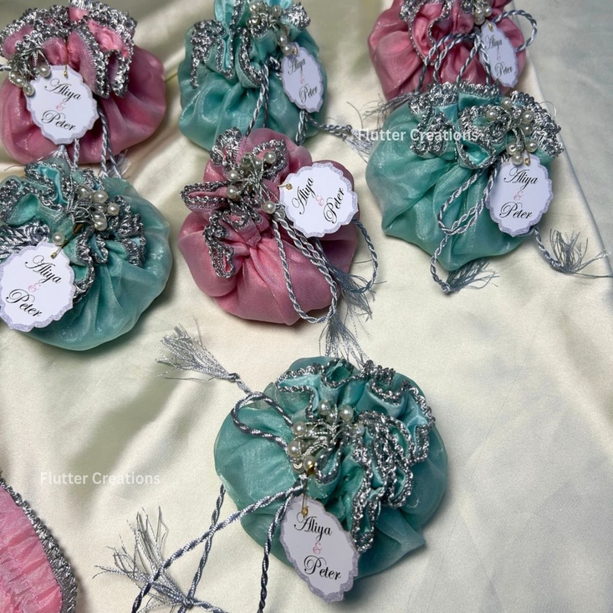 Pink and blue Organza Potlis with Silk lining , pearl tassel and tag