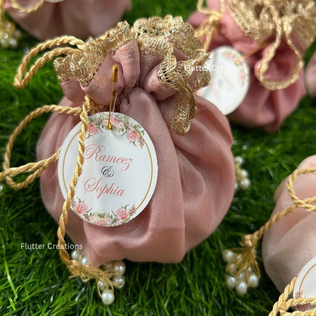 Pastel Pink Organza potlis with Double Pearl tassel and name tag