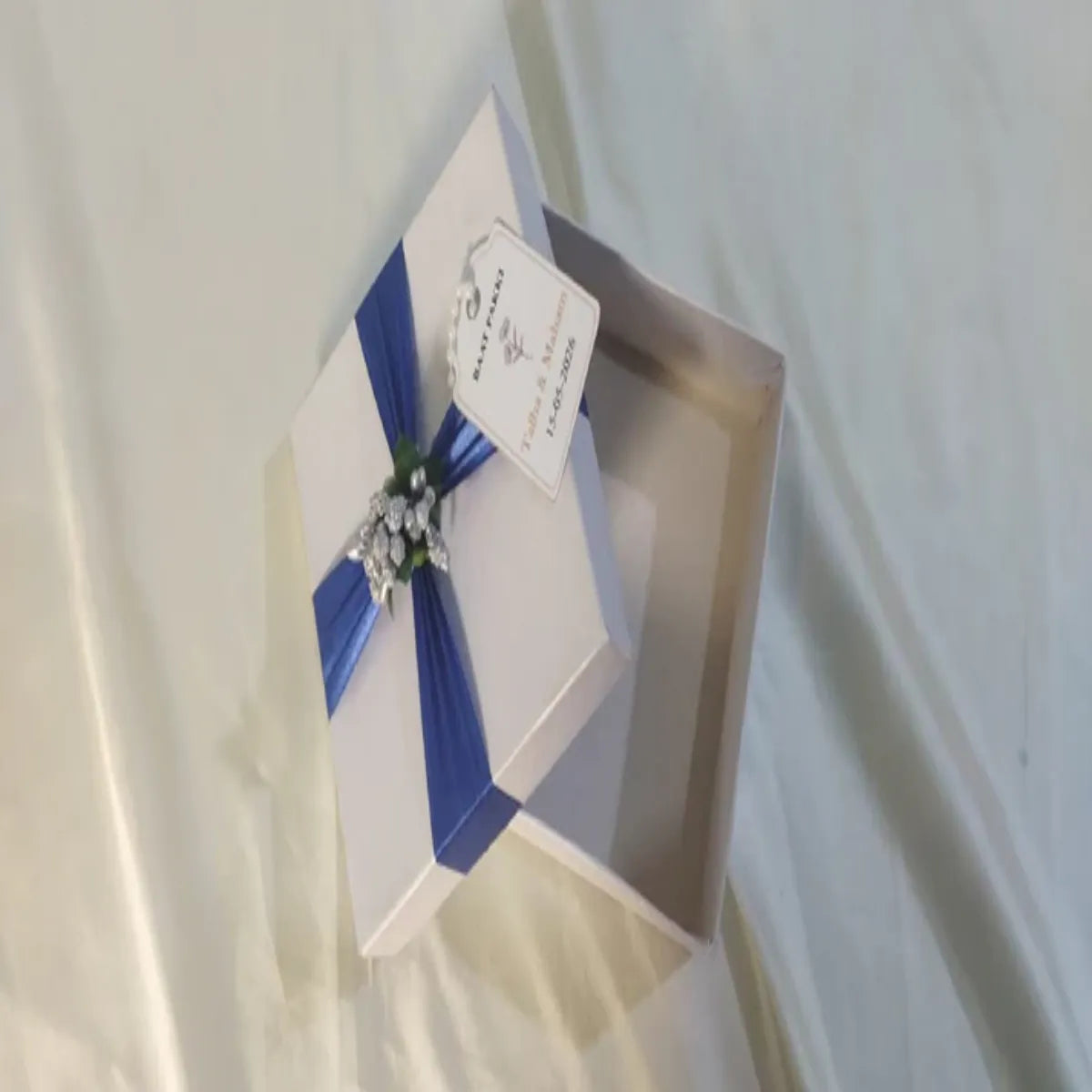 White Box with Blue ribbon and Silver Stamen flowers