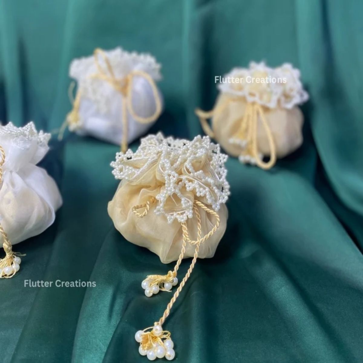 Golden & White Organza potlis/pouches with pearl lace and tassel