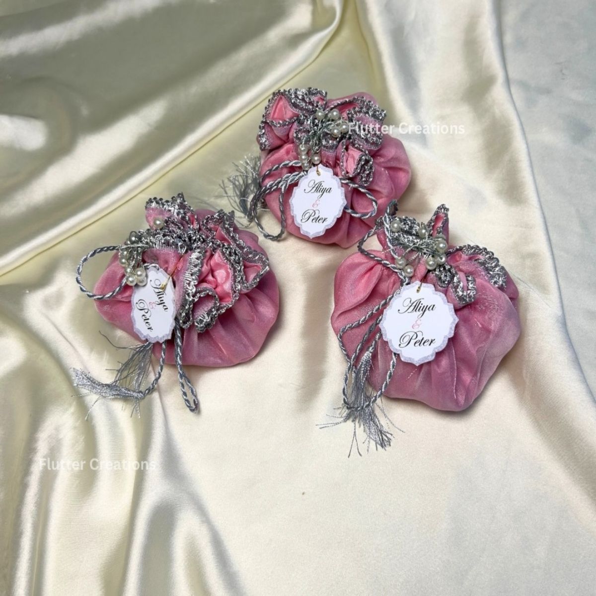 Pink and blue Organza Potlis with Silk lining , pearl tassel and tag