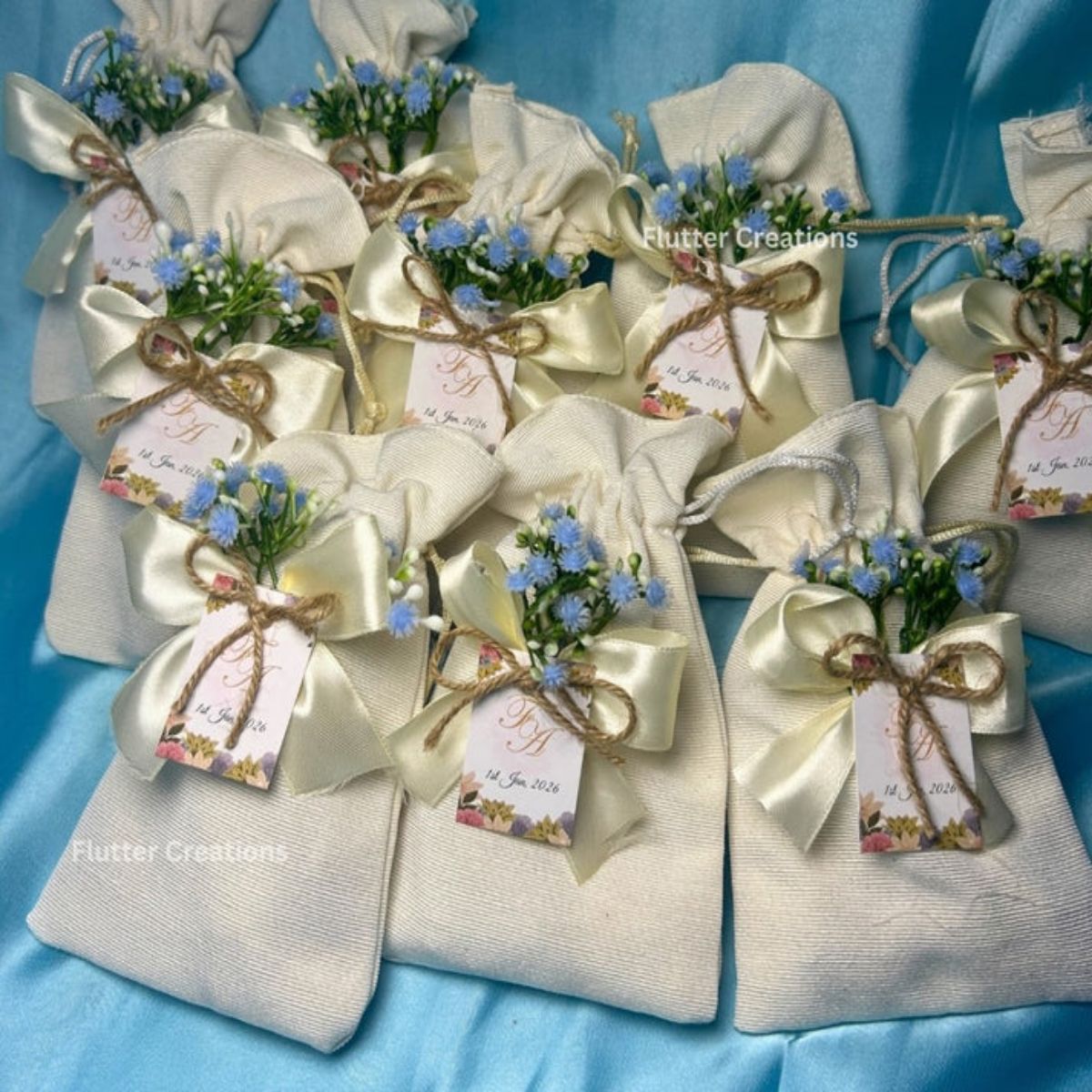 Premium White Pouches/potlis with Blue Baby's breath