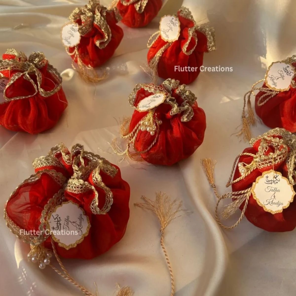 Red Organza potlis with pearl tassel and tag