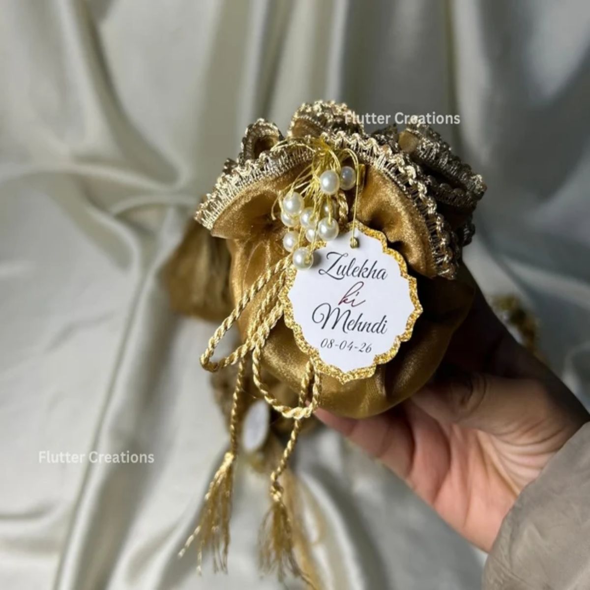 Brown Organza potlis with Silk Lining,pearl tassel and tag