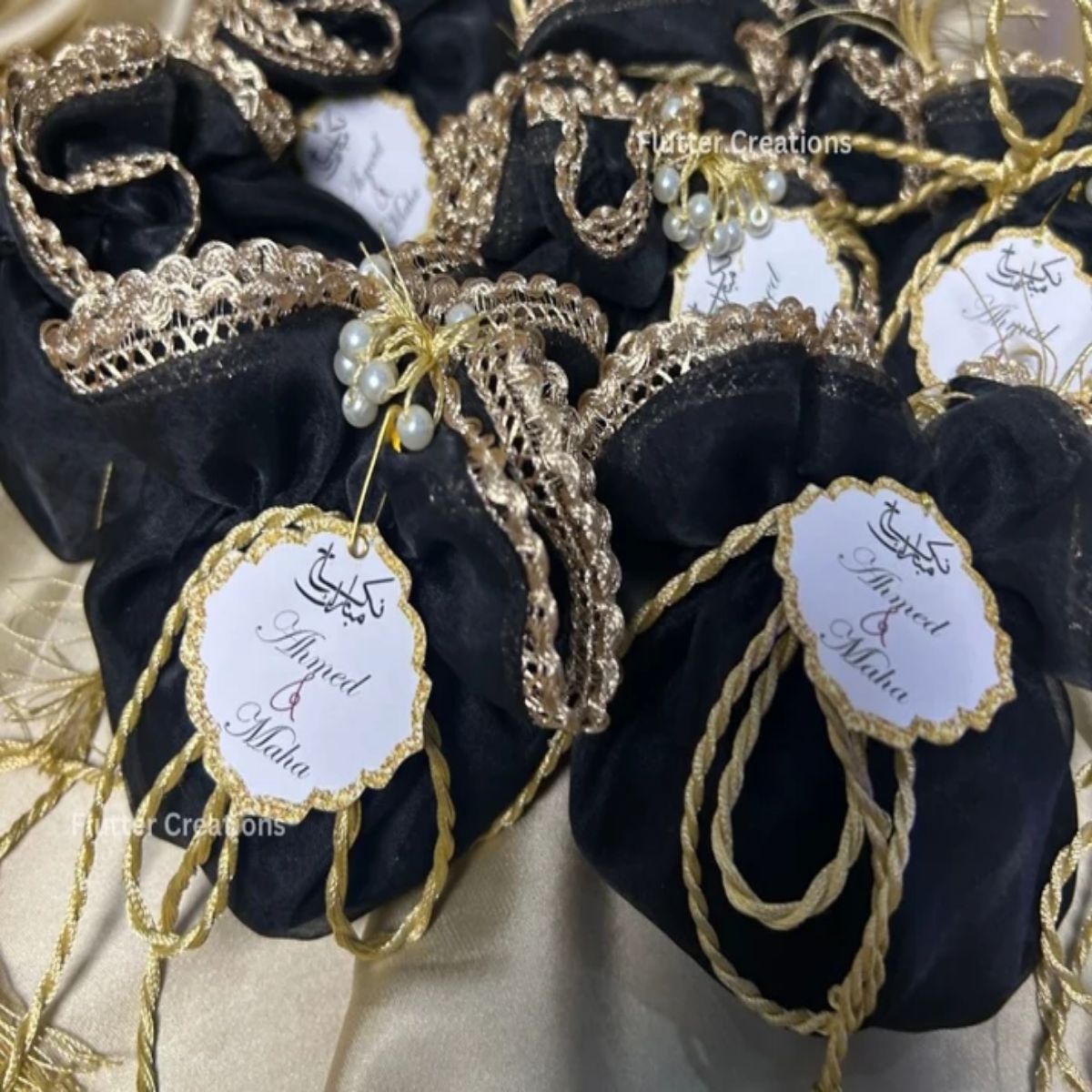 Black Organza potlis with Silk Lining,pearl tassel and tag