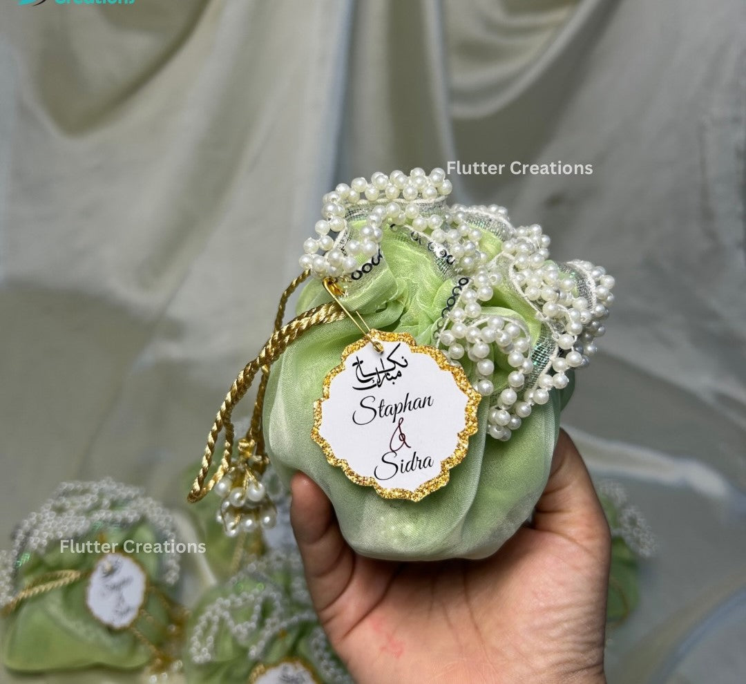 Light Green Organza potlis/pouches with pearl lace and tassel