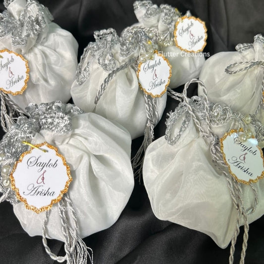 White Organza potlis with silver string ,pearl lace and tassel
