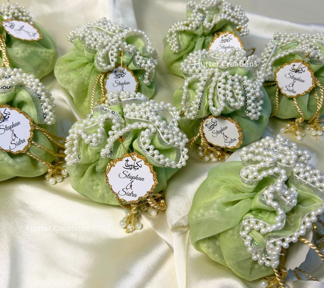 Light Green Organza potlis/pouches with pearl lace and tassel