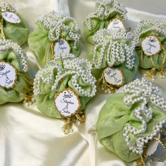 Light Green Organza potlis/pouches with pearl lace and tassel