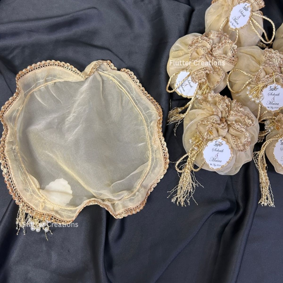 Beige Organza Potlis with single pearl tassel and name tag